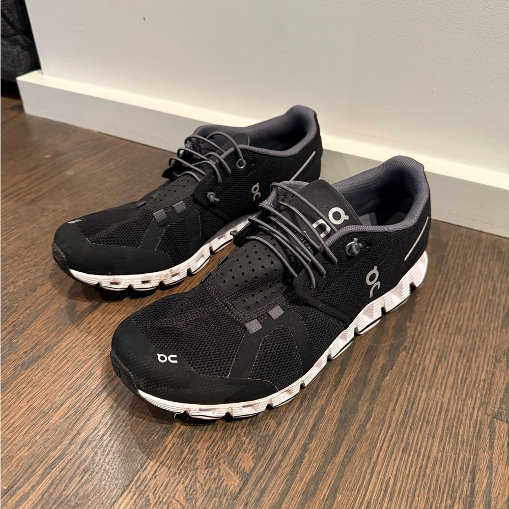 On Running Black and White Athletic Shoes with Modern Design